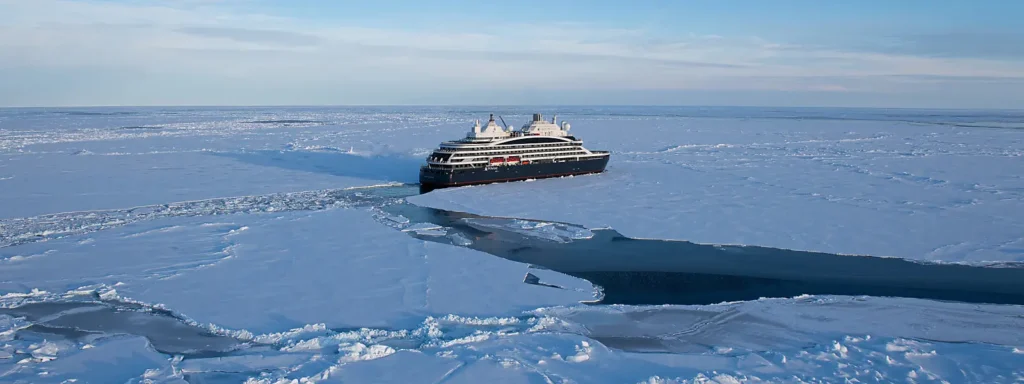 Le Commandant Charcot cruise ship breaking ice on an expedition sailing